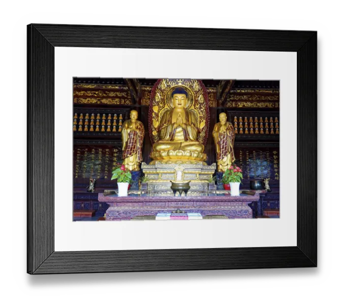 Framed Print : Golden Buddhist statues in a richly decorated worship room