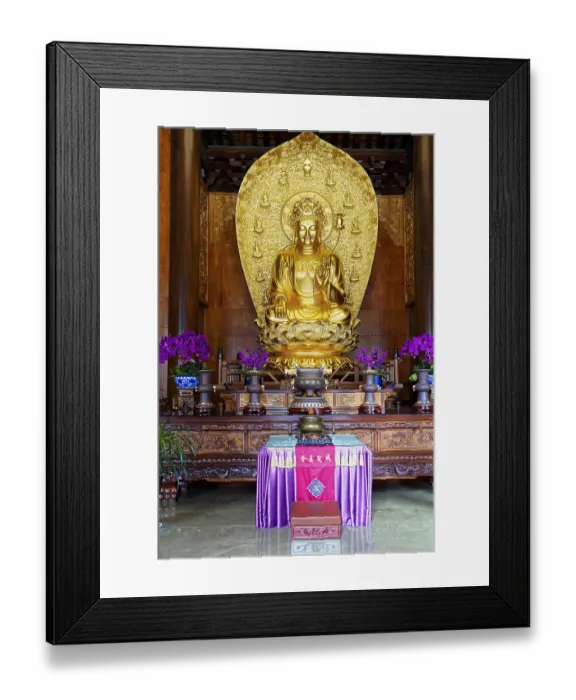 Framed Print : Majestic golden Buddha statue surrounded by purple orchids in prayer room Framed Print : Majestic golden Buddha statue surrounded by purple orchids in prayer room