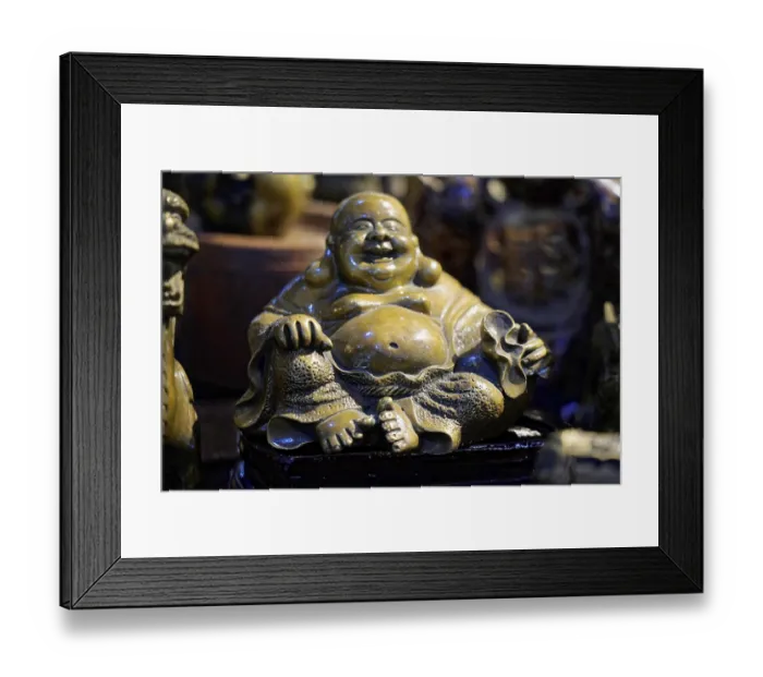 Framed Print : Bronze sculpture of a smiling seated Buddha