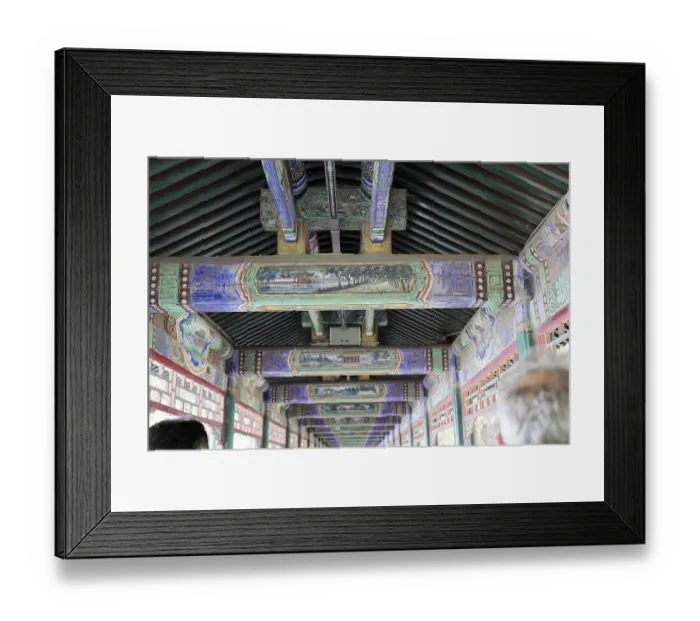 Framed Print : Ornate, painted ceiling beams in traditional architecture with rich detail