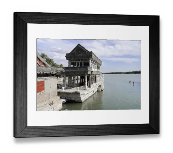 Framed Print : Stone building on water with traditional architecture under blue sky Framed Print : Stone building on water with traditional architecture under blue sky