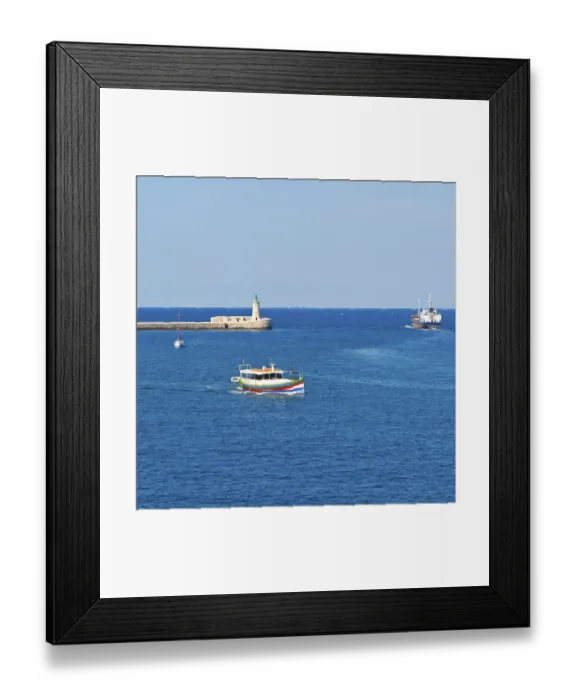 Framed Print : Cargo ship leaves the harbor of Valletta