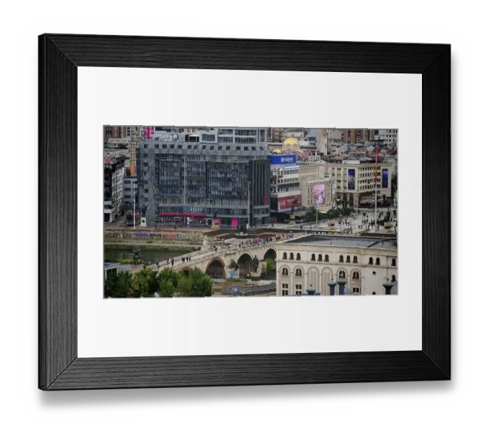 Framed Print : View of a city with a modern building and a bridge