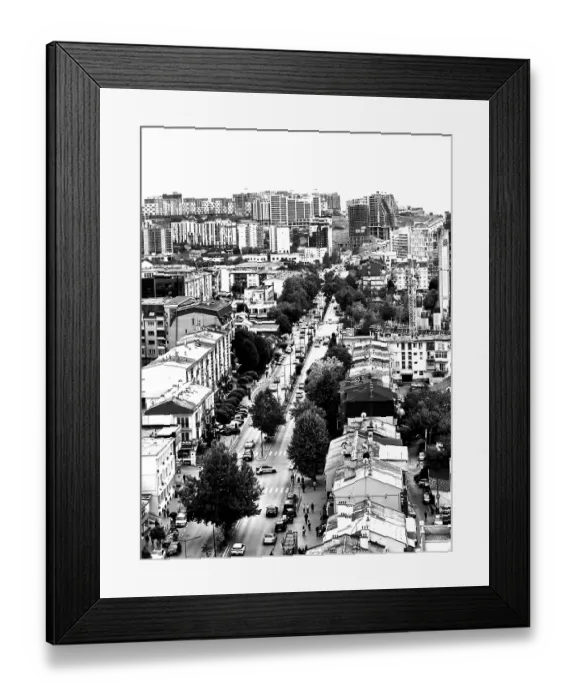 Framed Print : Aerial view of an urban environment with high-rise buildings and roads in black and white