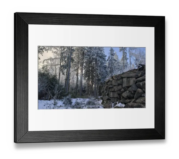 Framed Print : Cold winter picture with a pile of stones in the forest