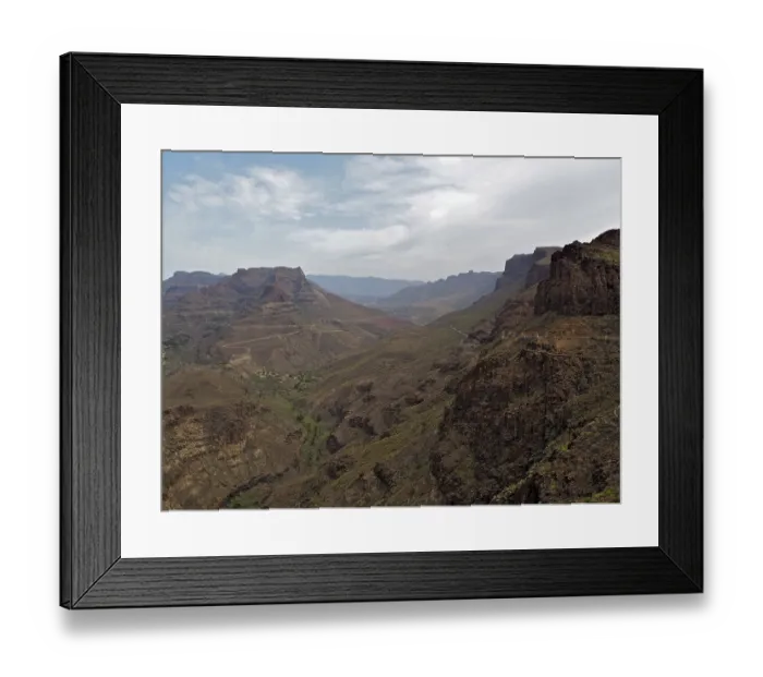 Framed Print : Dry mountain landscape with distinctive rocks under cloudy sky Framed Print : Dry mountain landscape with distinctive rocks under cloudy sky