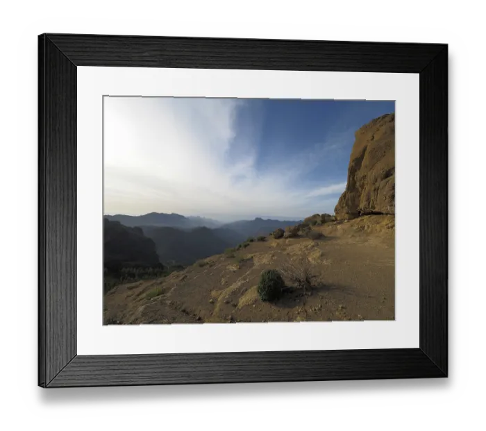Framed Print : Wide, rocky landscape with views of distant mountains under blue sky