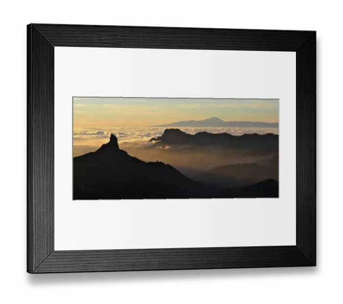Framed Print : Atmospheric mountain scenery at sunset over a sea of clouds