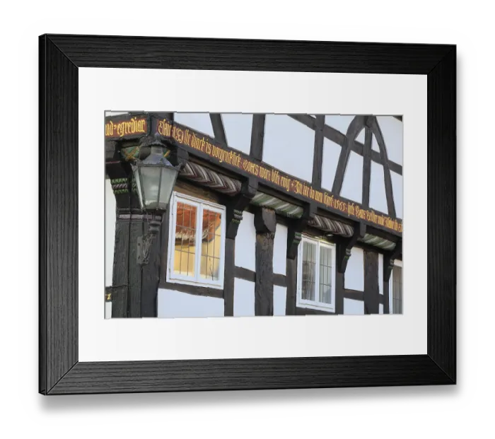 Framed Print : Banner on the facade of a 16th century half-timbered house