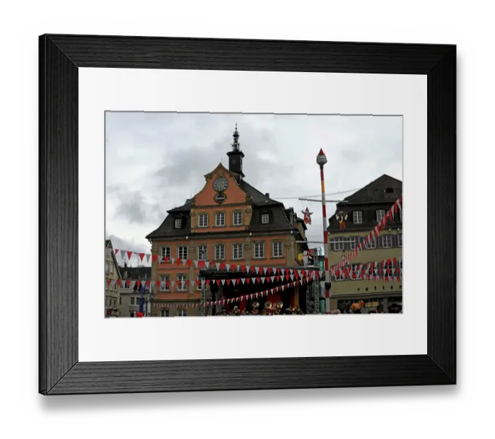 Framed Print : Town square with historic architecture and decorations indicative of a festival or event