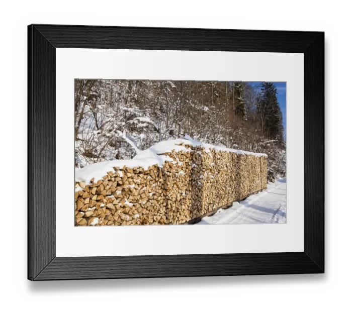 Framed Print : Pile of firewood. snowy firewoods in winter forest