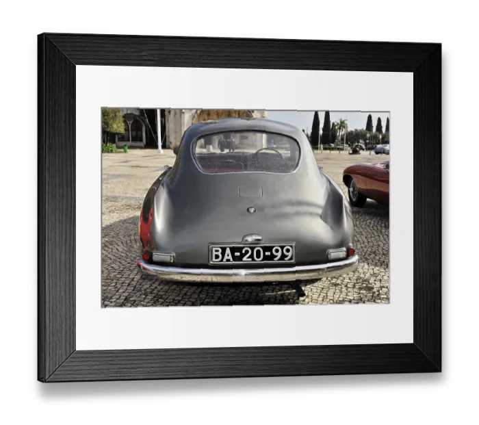 Framed Print : Grey vintage car parked from behind in a square