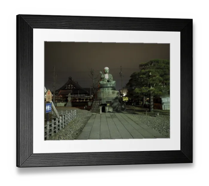 Framed Print : Large Buddha statue in front of a temple
