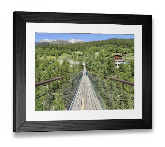 Framed Print : Extensive suspension bridge in idyllic mountain and forest areas in sunny weather