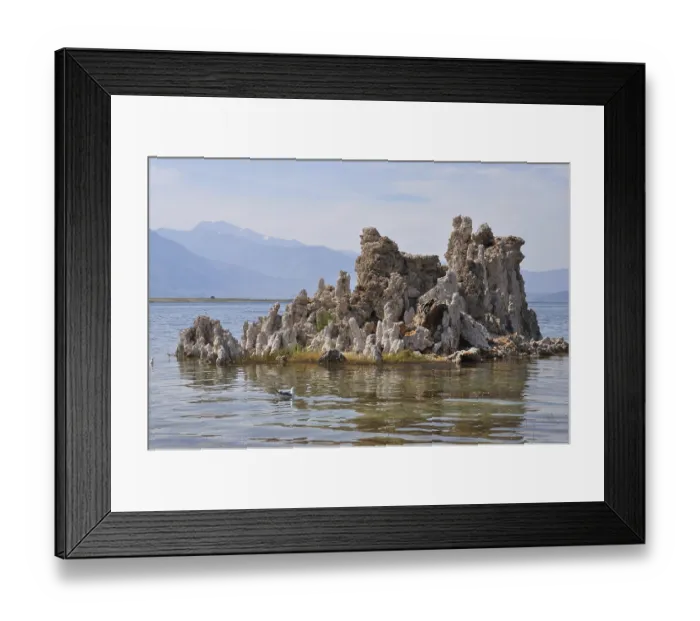 Framed Print : Rocks, limestone formations, in a calm lake