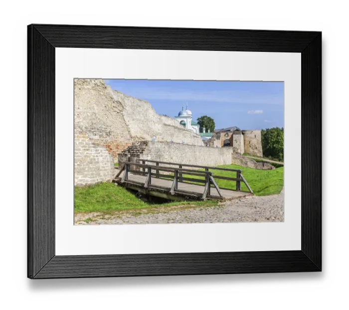 Framed Print : Ancient weathered rough stone walls and tower of the Izborsk fortress