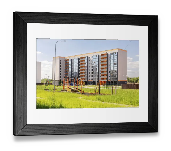 Framed Print : Veliky, Russia - August.29.2024 : New residential building with a modern playground in the city courtyard