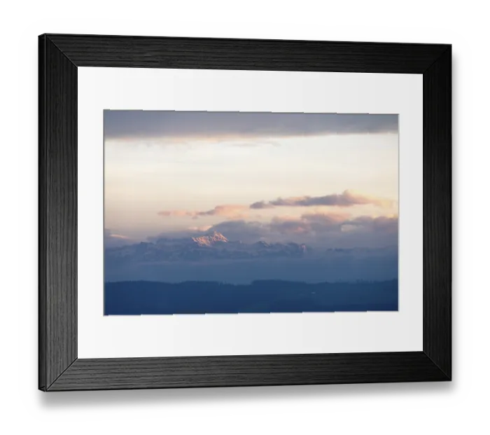 Framed Print : Snowy mountains and clouds at a gentle dusk or dawn