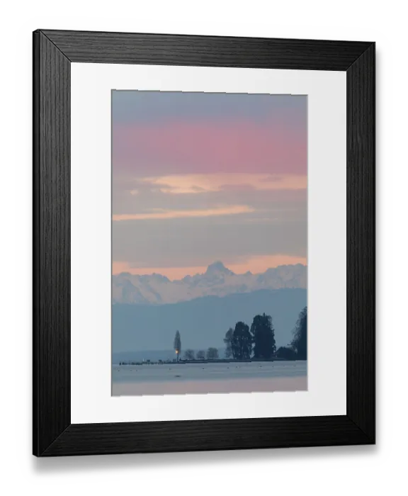 Framed Print : Pastel-colored sky over a lake and mountains in the distance