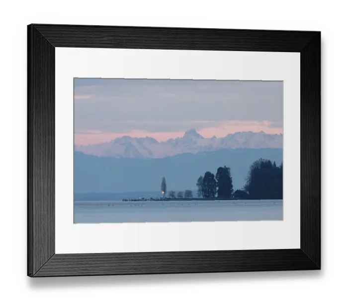 Framed Print : Evening light turns the sky pink over a peaceful lake with mountains