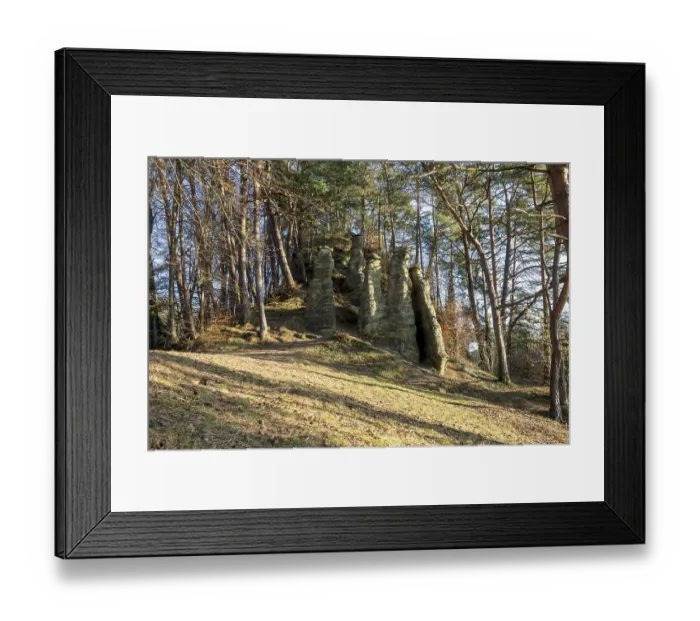 Framed Print : Rock formation in a forest illuminated by sunlight Framed Print : Rock formation in a forest illuminated by sunlight