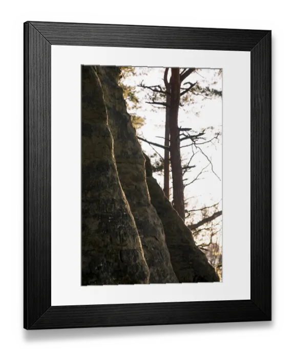 Framed Print : Rocks with a narrow strip of light