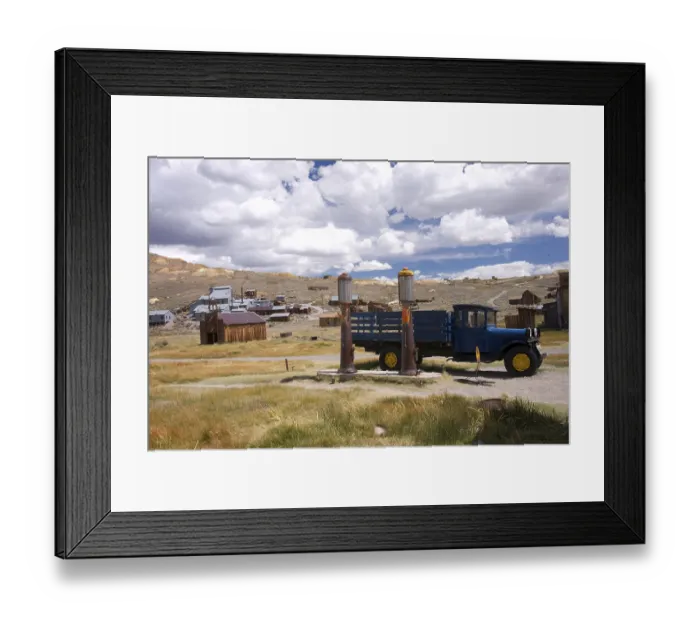 Framed Print : An old vintage truck stands beside old fashioned gas pumps at a California gold mining ghost town