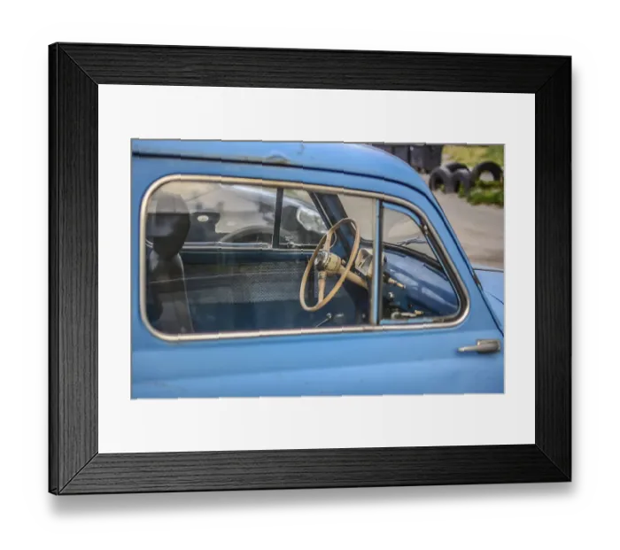 Framed Print : Side part of bright blue old automobile with wheel in window Framed Print : Side part of bright blue old automobile with wheel in window