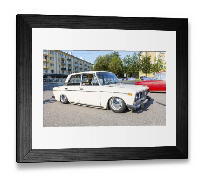 Framed Print : Novgorod, Russia - August 31, 2024: Vintage soviet tuned Lada-2103 lowered suspension vehicle at the city street