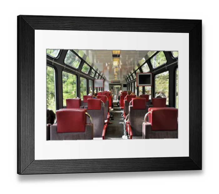 Framed Print : Interior of a train with red seats and large windows