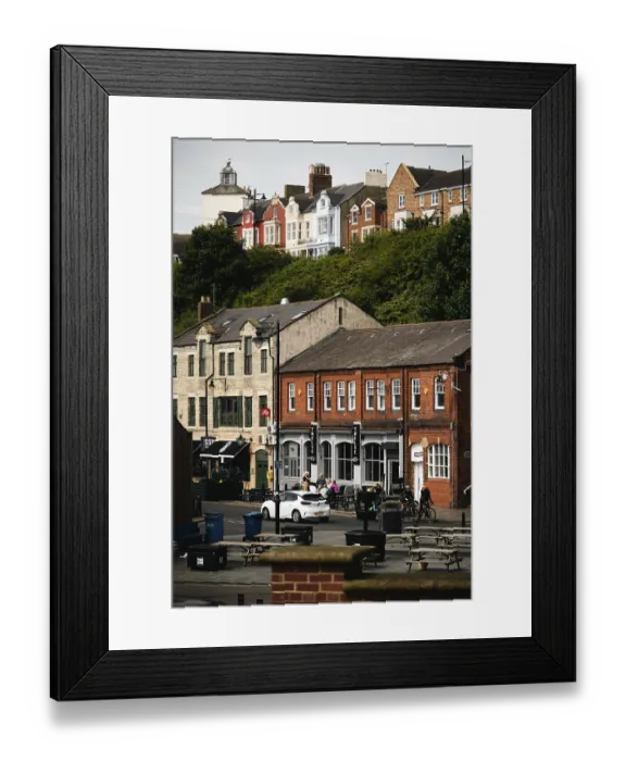 Framed Print : Vibrant street with shops and people