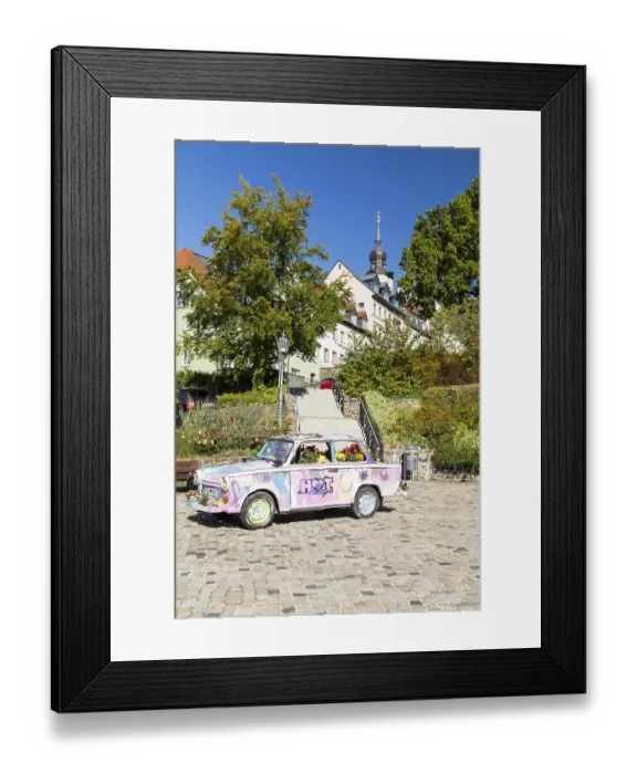 Framed Print : Colourfully painted and planted Trabant car on the old market in Hohenstein-Ernstthal