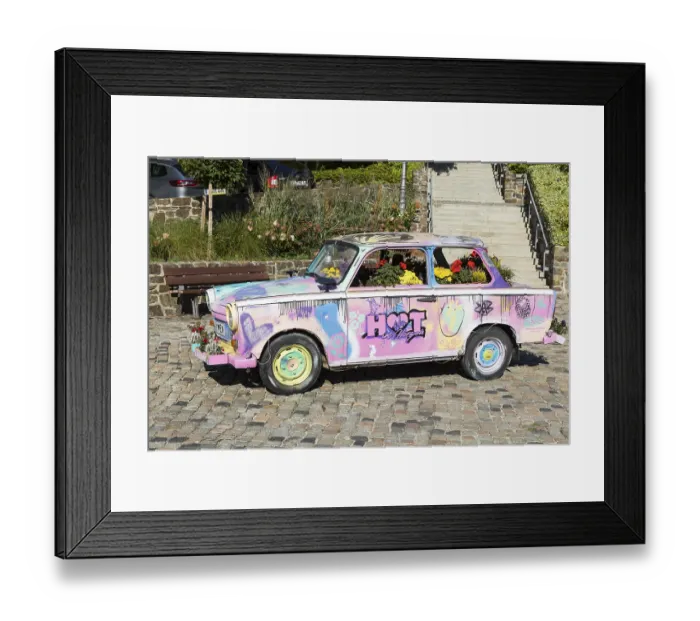 Framed Print : Colourfully painted and planted Trabant car on the old market in Hohenstein-Ernstthal