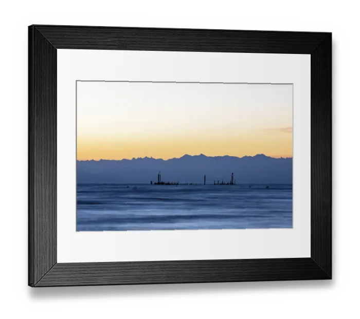 Framed Print : Peaceful lake with mountains on the horizon at sunrise