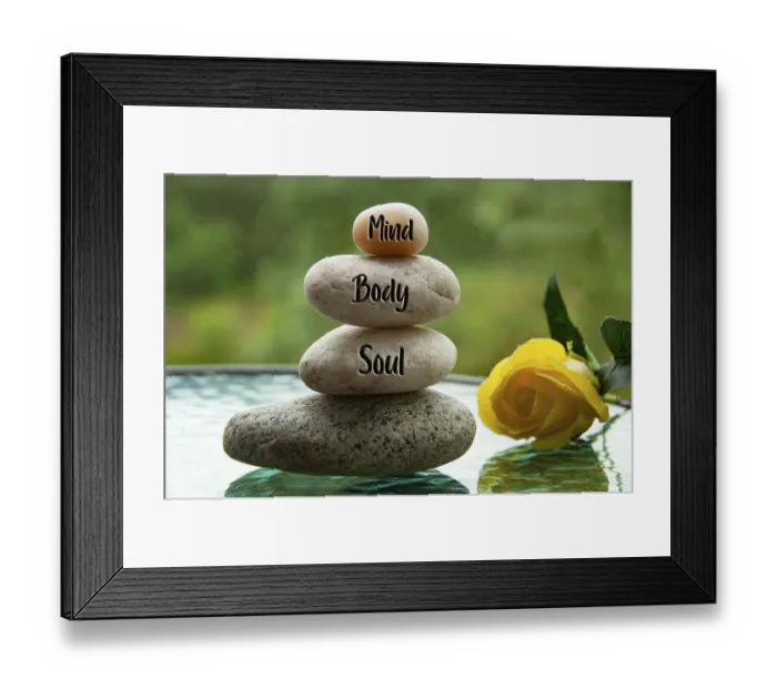 Framed Print : Mind, Body and Soul words engraved on zen stones with blurred nature and yellow rose background