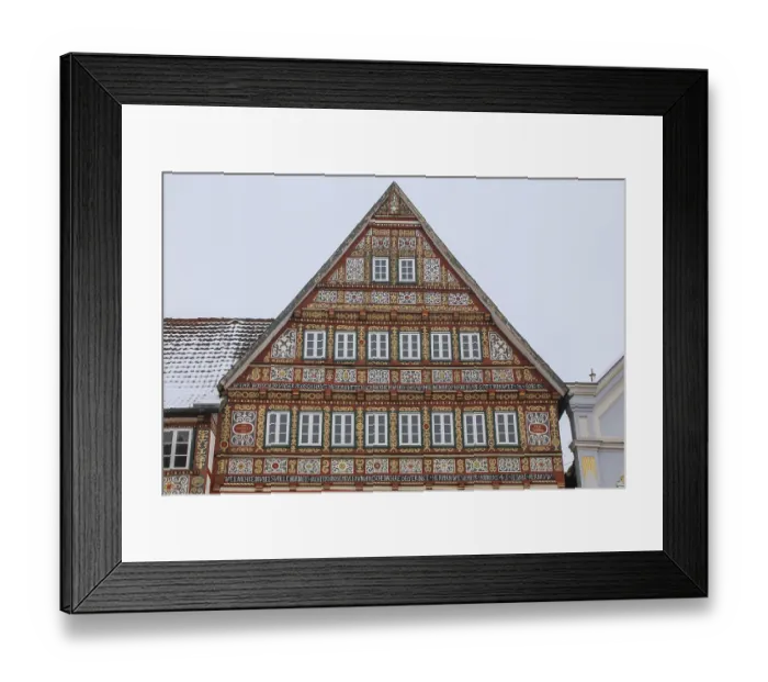 Framed Print : Colourfully painted half-timbered house on the market square