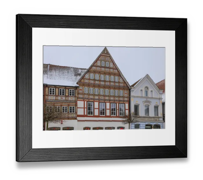 Framed Print : Colourfully painted half-timbered house on the market square