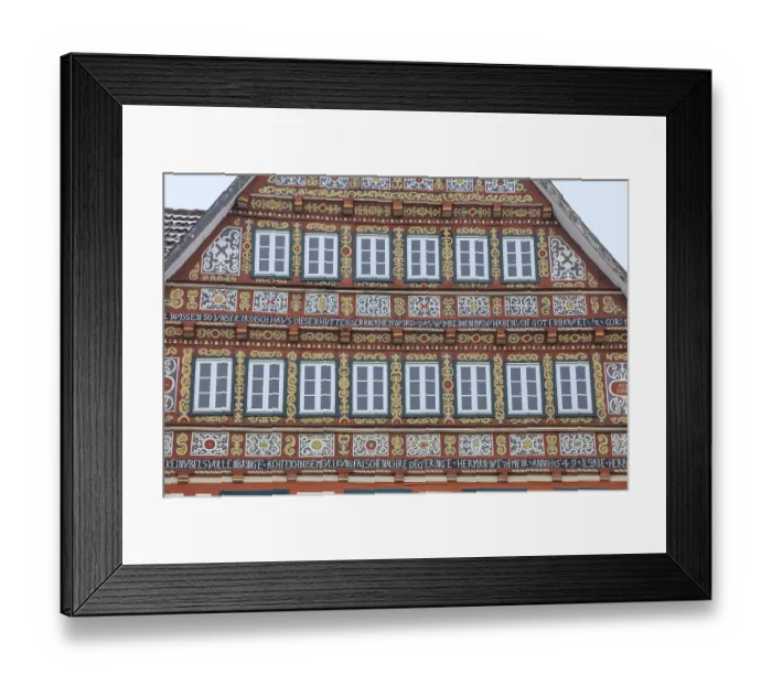 Framed Print : Colourfully painted half-timbered house on the market square