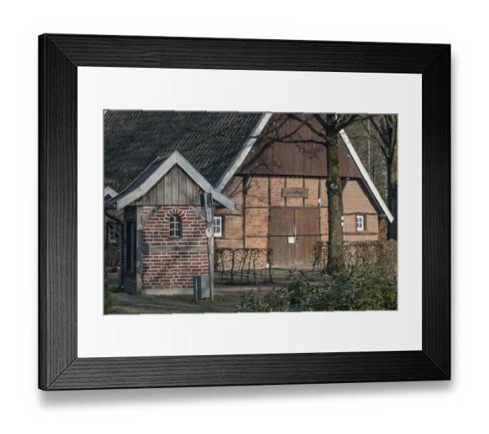 Framed Print : Half-timbered house with tiled roof surrounded by trees in a wintery atmosphere