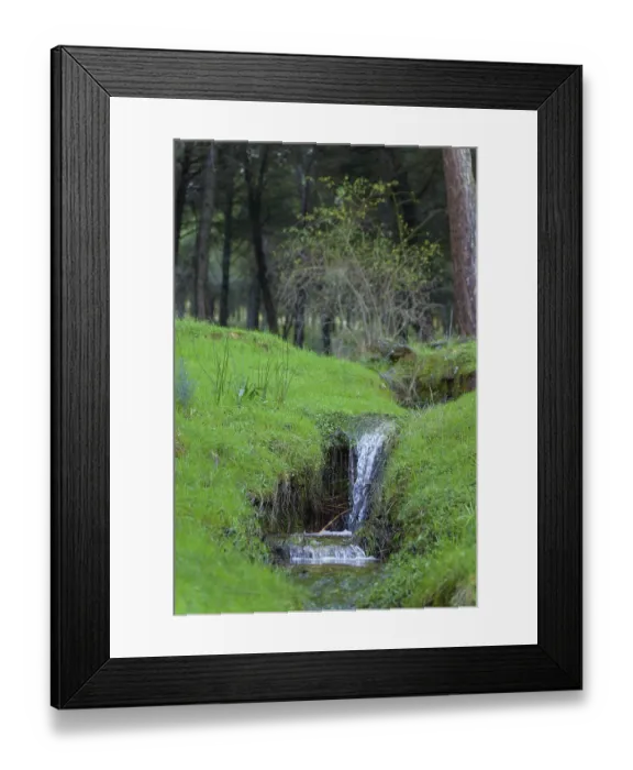Framed Print : Ronda, malaga, spain Water flowing over a tiny waterfall amidst lush green grass Framed Print : Ronda, malaga, spain Water flowing over a tiny waterfall amidst lush green grass