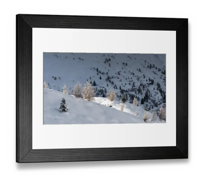 Framed Print : Snow-covered mountainous landscape with scattered trees Framed Print : Snow-covered mountainous landscape with scattered trees
