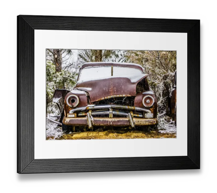 Framed Print : Old vintage plymouth automobile in the woods covered in snow Framed Print : Old vintage plymouth automobile in the woods covered in snow