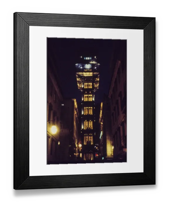Framed Print : Santa Justa lift between rows of historic houses during the day