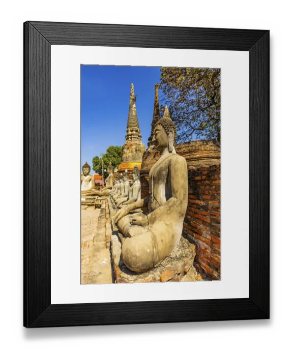 Framed Print : Stone Buddha statues sitting in a row
