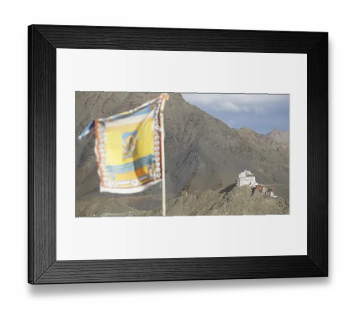 Framed Print : Tibetan Buddhist prayer flag with Namgyal Tsemo Buddhist monastery surrounded by mountains and sky