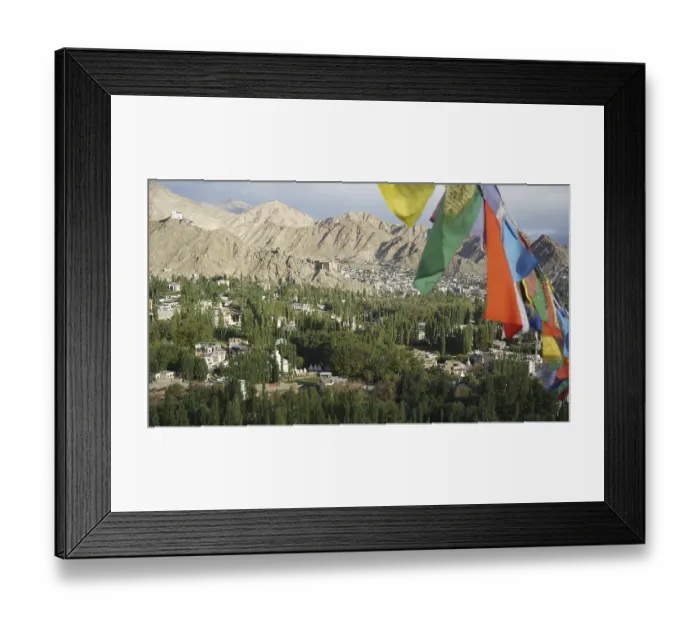 Framed Print : Colourful prayer flags against a green Framed Print : Colourful prayer flags against a green