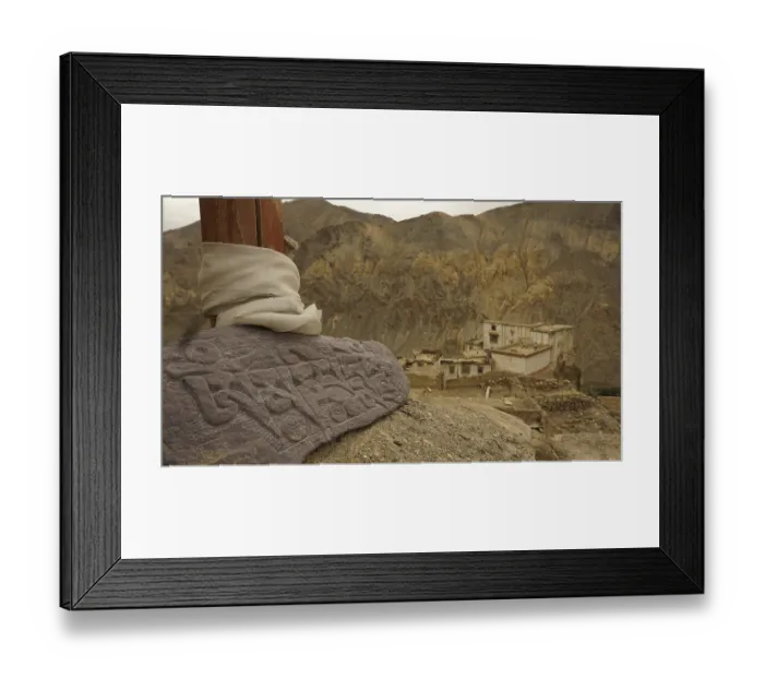 Framed Print : An engraved Mani stone in a mountainous landscape