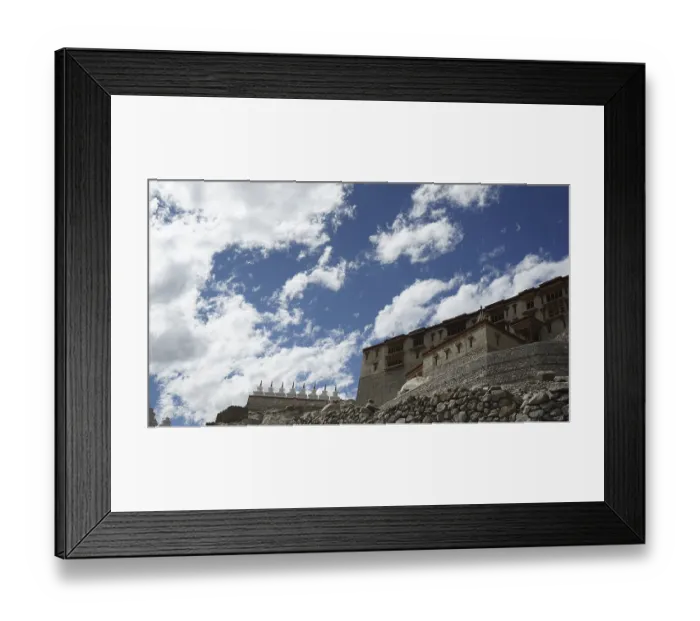 Framed Print : Stone Buddhist monastery building under a dramatic sky full of clouds