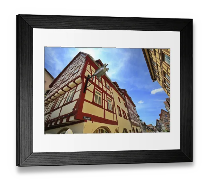 Framed Print : Painted timber-frame house under clear sky
