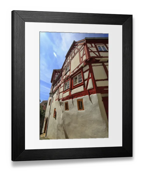 Framed Print : Traditional half-timbered house with distinctive red beams and white facade elements in Bad Wimpfen